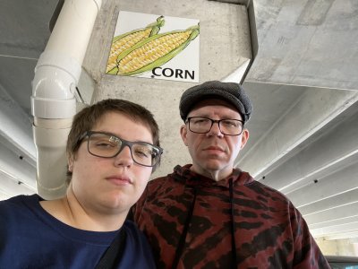 Elyse and I make angry (or at least annoyed) faces in front of the corn sign at a Wegmans in Virginia Beach.  This is in keeping with an Internet meme where you're supposed to leave an "angry" reaction on photos of corn on social media.  Yes, it's dumb, but it's funny.