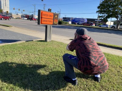 Evan got a photo of me Slav-squatting while photographing an Arby's sign in Virginia Beach.