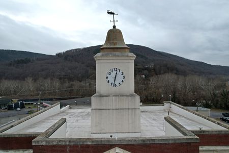 I found it slightly disappointing that the Clifton Forge Town Hall was flat-roofed, and the clock tower was simply a structure rising from that flat roof.  I was expecting a gabled roof that harmonized with the triangular pediment, with the clock tower rising from that.