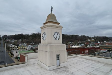 I found it slightly disappointing that the Clifton Forge Town Hall was flat-roofed, and the clock tower was simply a structure rising from that flat roof.  I was expecting a gabled roof that harmonized with the triangular pediment, with the clock tower rising from that.