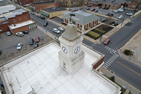 I found it slightly disappointing that the Clifton Forge Town Hall was flat-roofed, and the clock tower was simply a structure rising from that flat roof.  I was expecting a gabled roof that harmonized with the triangular pediment, with the clock tower rising from that.