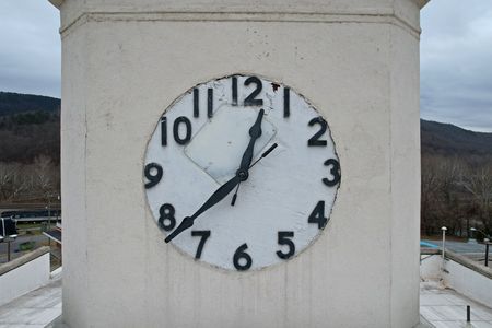 North facade of the clock tower.  Note the patch on the front of the clock face.  The time displayed accurately reflects the time that this photo was taken.