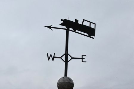 Railroad weathervane atop the clock tower.