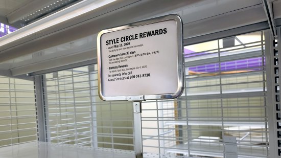 Signage explaining what would happen with Stage's rewards program and store credit cards.