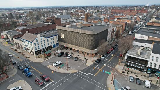 The building in the center of this photograph is the building that Evan found interesting, that he went to check out.  I don't recognize the logo on the building, though.  Anyone recognize it?