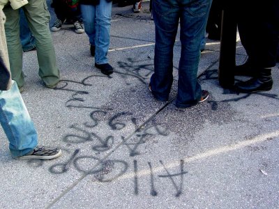 Graffiti on the sidewalk in front of the Capitol