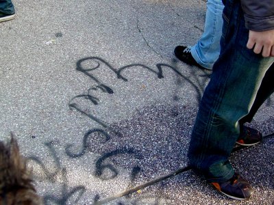 Graffiti on the sidewalk in front of the Capitol