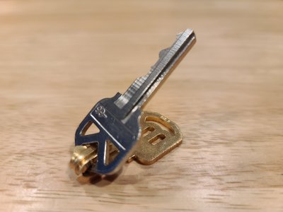 The unauthorized key bent around the authorized key