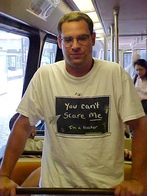 I got a photo of this guy on the train because I liked his shirt: "You can't scare me.  I'm a teacher."  I got the photo to show to Mom, who, at the time, worked as a middle school teacher.