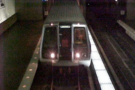 An Orange Line train to Vienna arrives at Virginia Square station.