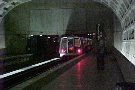 A Blue Line train traveling towards Franconia-Springfield departs Pentagon City station.