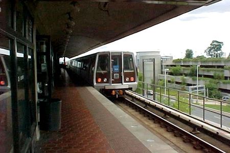 A Blue Line train traveling towards Franconia-Springfield departs National Airport station.