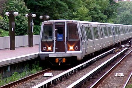 A Blue Line train arrives at Arlington Cemetery station on its way to Franconia-Springfield.