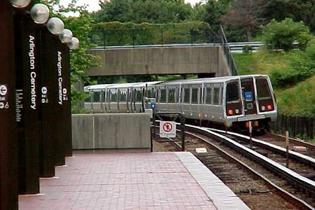 A Blue Line train departs Arlington Cemetery station on its way to Franconia-Springfield.