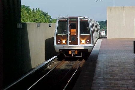 Orange Line train to Vienna arriving at East Falls Church station.