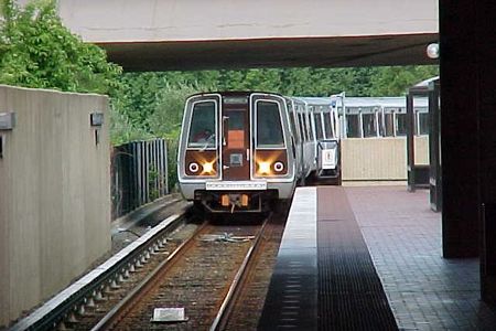 A Vienna-bound Orange Line train arrives at West Falls Church station.