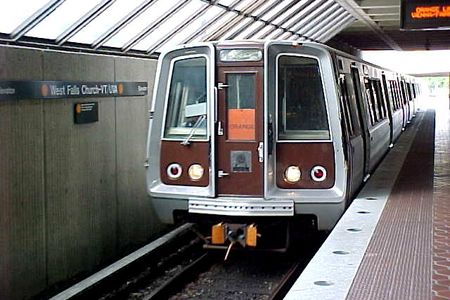 A Vienna-bound Orange Line train arrives at West Falls Church station.