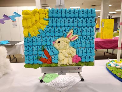 Picture of a rabbit carrying carrots made out of Peeps.