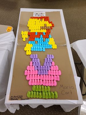 Super Mario made out of Peeps, showing Mario jumping over a piranha plant.