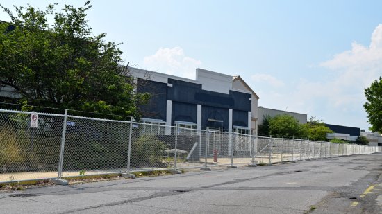 Fencing in front of the former Wills/Books-A-Million store.