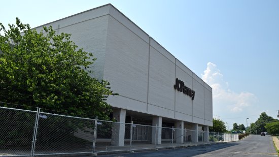 Fencing in front of the JCPenney building.  This building was originally to have been retained in the redevelopment of the mall, but with the closure of Penney's in October 2020, this is clearly no longer the case.