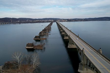 The Veterans Memorial Bridge, with the piers of a former bridge adjacent to it.