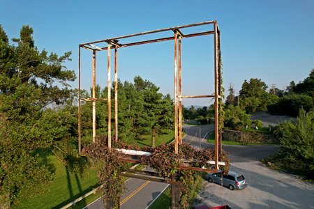 The Howard Johnson's sign is now quite overgrown.  Most of the "WELCOME" lettering from the sign is gone now, and then the Howard Johnson's sign face has been gone for something like 17 years at this point.  It blew out one day and then was just never replaced.