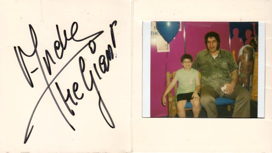 My ten-year-old self, sitting on a bench with Andre the Giant, with a balloon looped around my hand.