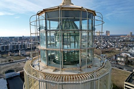 Close-up showing the Fresnel lens at the top of the lighthouse.