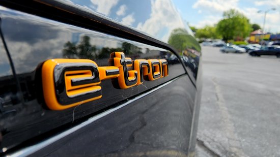 Close-up of the e-tron badging on the side of the car.