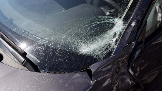 The damage to the windshield.