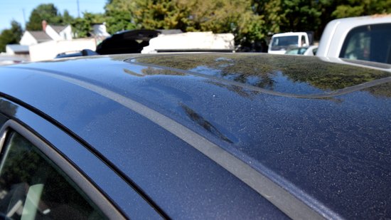 I found this bit of damage to be somewhat curious.  These are little dents on either side of the moon roof - one on each side.  I can understand how the one on the left side of the car (top photo) happened, since that's the side that took the impact, but the one on the right (bottom photo) surprised me, being on the off-side.