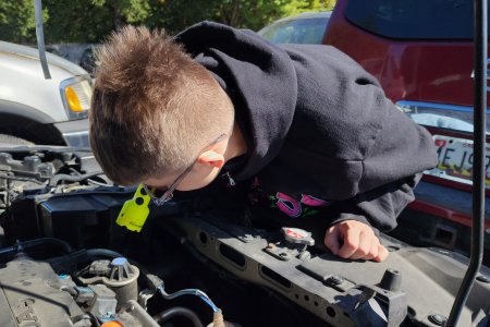 Elyse takes a look under the hood of the car