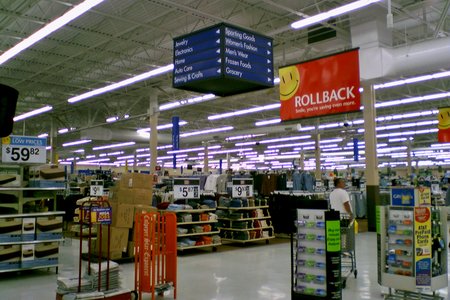 Front left corner of the action alley, in front of the general merchandise entrance.