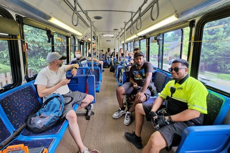 The group on bus 97, going on a final ride with the Orion Vs.