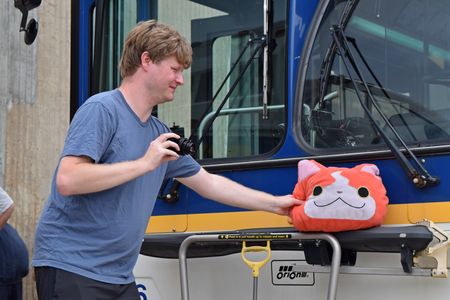 Brian gets a photo of his Jibanyan plush, aka "Kitty", on the bike rack of bus 97.
