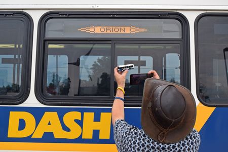 Fred gets photos of the model bus with the full-size bus.