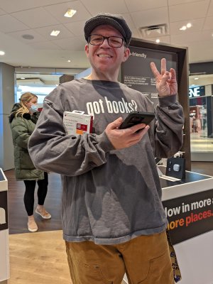 Elyse got a photo of me holding her screen protector and my own phone with one of the demo phones at the Verizon store in Deptford Mall.  This was taken on some sort of Google Pixel device.