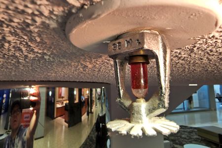 This photo of a sprinkler head was taken under a stair that Matthew and I were next to.  I give myself an "A" for effort, but it didn't come out very well.  Though the reflection of me taking the photo amused me.  I didn't notice that when I was taking it, but I laughed when I spotted it later on.