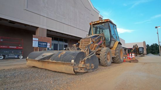 Heavy equipment in front of the former Lowe's