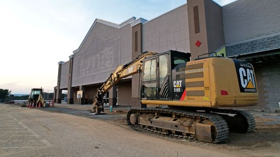 Heavy equipment in front of the former Lowe's