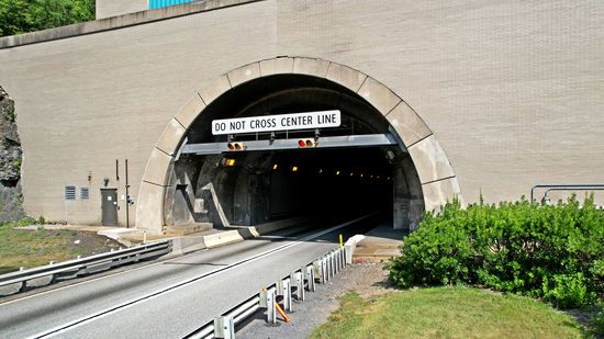 Tunnel for westbound traffic.  This is the original tunnel, first bored for the South Pennsylvania Railroad in the late 1800s but never completed, and later repurposed for use by the turnpike.
