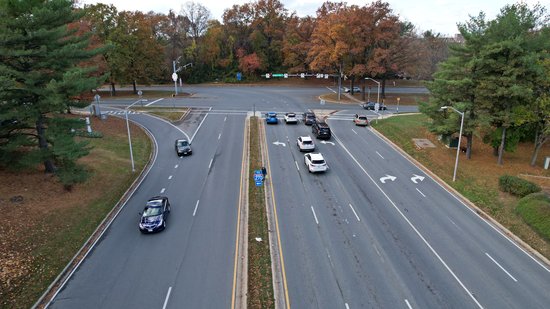 The intersection as viewed from the approach on Midcounty Highway.