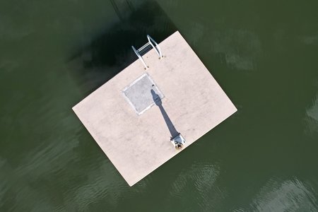 This large concrete object on the water, which I assume has something to do with the way that water passes through the dam.