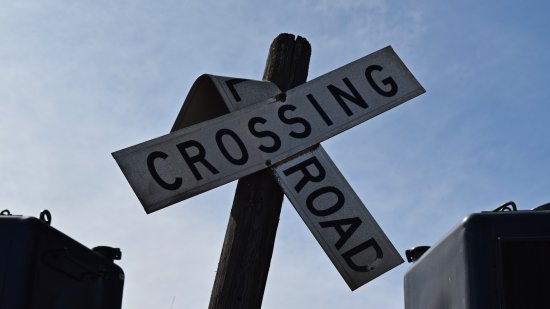 Wilted-looking crossbuck sign.