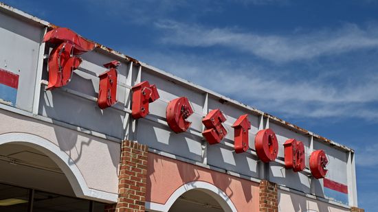 Sign for a Firestone tire shop in Cavalier Square.