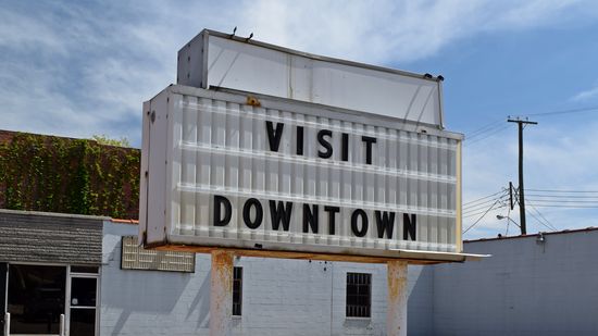 "VISIT DOWNTOWN" sign off of East Cawson Street.