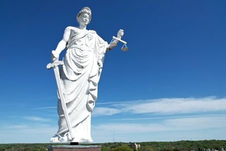 Low angle of the statue from her right side.  I was surprised to find that the statue was attached to the rest of the structure via a relatively small pole, and that there was a gap between the statue and the rest of the tower.