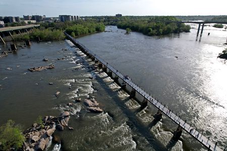 Aerial view of a footbridge over the James River.  On my previous visits to this part of Richmond, this bridge was still an abandoned railroad bridge, cut off from actual use.  Now it connects all the way across, and people were using it.  I didn't go across the bridge due to time constraints, but it definitely seems worth exploring in the future.