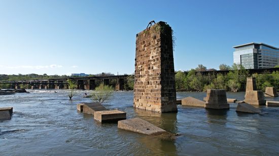 A disused bridge pier, presumably for a former railroad line, along with some other disused concrete structures.